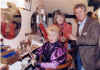 Judith Miller & Ross Benson filming an episode of Antiques Trail. Ross is using an Edwardian massager on Annette's back.