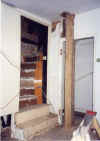Small bedroom with attic stairs leading off. A new stud wall was put across the room to make the Radio Shop and inner hall.